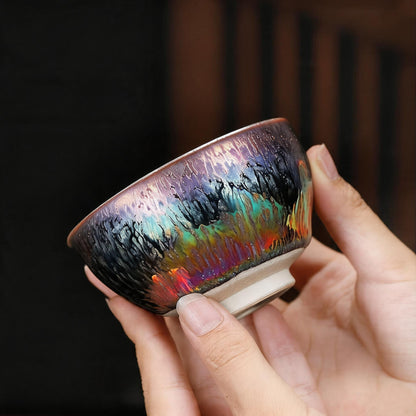 Side profile of Iridescent Bloom Tenmoku showing natural kiln-changed glaze drips and metallic finish.